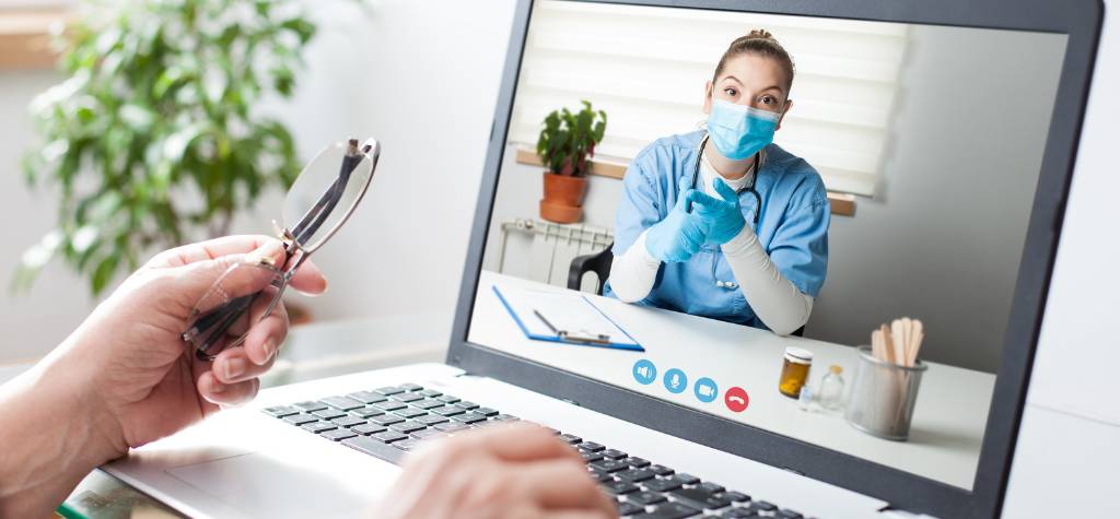 A Telemedicine Provider talking to a patient on a laptop