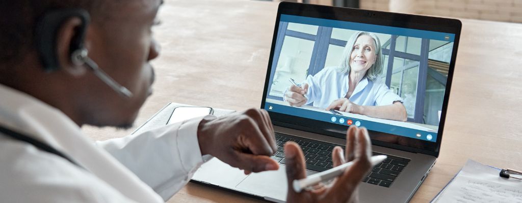 A doctor talking to a telemedicine patient